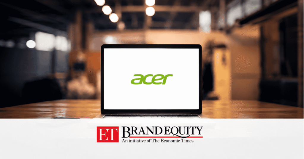 Laptop displaying the Acer logo on a desk in a blurred office setting, with ET Brand Equity branding featured in a white banner at the bottom.