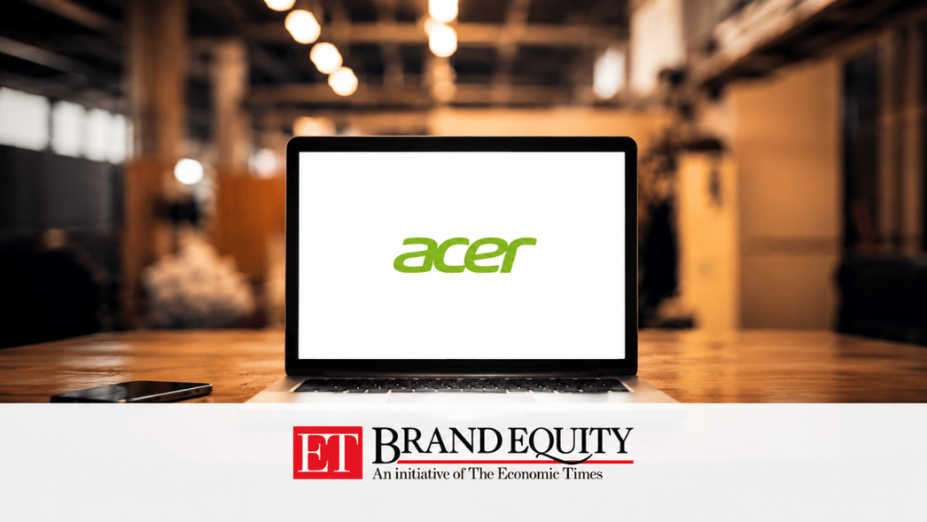Laptop displaying the Acer logo on a desk in a blurred office setting, with ET Brand Equity branding featured in a white banner at the bottom.